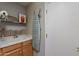 Functional laundry room with utility sink, and adjacent door at 9642 E Irwin Ave, Mesa, AZ 85209