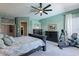 Spacious main bedroom features wood furnishings, ceiling fan, ensuite, and exercise equipment at 9642 E Irwin Ave, Mesa, AZ 85209