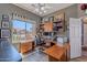 Office featuring hard wood floors, ample natural light, a writing desk, and built-in storage at 9642 E Irwin Ave, Mesa, AZ 85209