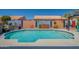 Backyard pool features Baja step, lovely landscaping and hardscape at 9642 E Irwin Ave, Mesa, AZ 85209