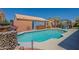 Sparkling pool with unique water feature, lush landscaping and ample deck space at 9642 E Irwin Ave, Mesa, AZ 85209