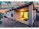 Exterior view of a home showing the covered back patio and gravel landscaping at 9704 W Cordes Rd, Tolleson, AZ 85353