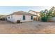 View of the home's backyard showcasing the low maintenance xeriscape landscaping and privacy fence at 9704 W Cordes Rd, Tolleson, AZ 85353