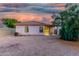 Exterior view of a home showing the covered back patio and gravel landscaping at 9704 W Cordes Rd, Tolleson, AZ 85353