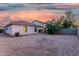 View of the backyard featuring gravel landscaping and covered patio at 9704 W Cordes Rd, Tolleson, AZ 85353