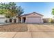 Charming single-story home with a two-car garage, low maintenance landscaping and a private drive at 9704 W Cordes Rd, Tolleson, AZ 85353