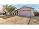 Charming single-story home with a two-car garage, xeriscape landscaping and a private drive at 9704 W Cordes Rd, Tolleson, AZ 85353