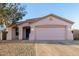 Charming single-story home with a two-car garage, xeriscape landscaping and a private drive at 9704 W Cordes Rd, Tolleson, AZ 85353