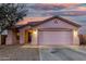 Charming single-story home with a two-car garage and low maintenance gravel landscaping at 9704 W Cordes Rd, Tolleson, AZ 85353