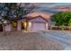 Inviting single-story home featuring desert landscaping, covered entry, and attached two-car garage at 9704 W Cordes Rd, Tolleson, AZ 85353