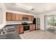Traditional eat-in kitchen featuring stainless steel appliances and sliding glass doors to the patio at 9704 W Cordes Rd, Tolleson, AZ 85353