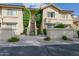 Inviting condo exterior with desert landscaping and stairs leading to the second level at 9711 E Mountain View Rd # 2543, Scottsdale, AZ 85258