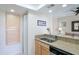 Galley kitchen with stainless steel appliances and granite countertops at 9711 E Mountain View Rd # 2543, Scottsdale, AZ 85258