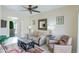 Comfortable living room featuring neutral colors, ceiling fan and tile flooring at 9711 E Mountain View Rd # 2543, Scottsdale, AZ 85258