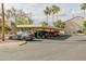 View of parking area with multiple parking spaces under a covered structure, offering shaded parking at 9711 E Mountain View Rd # 2543, Scottsdale, AZ 85258