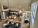 A bright, open living space with a kitchen, island, and dining area, featuring wood floors and a view from above at 16016 S 7Th S St, Phoenix, AZ 85048