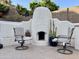 Inviting outdoor fireplace with seating, perfect for relaxing evenings at 16016 S 7Th S St, Phoenix, AZ 85048