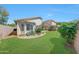 A backyard featuring lush green grass, garden beds and a privacy fence for outdoor enjoyment at 16036 N 11Th Ave # 1084, Phoenix, AZ 85023