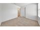 Neutral bedroom featuring carpet, fresh white walls, and bi-fold closet doors at 16036 N 11Th Ave # 1084, Phoenix, AZ 85023