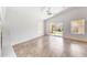 Bright bedroom with tile flooring, a ceiling fan, and sliding glass doors leading to the backyard at 16036 N 11Th Ave # 1084, Phoenix, AZ 85023