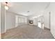 Spacious living room with carpet flooring, a fireplace, and a large window providing natural light at 16036 N 11Th Ave # 1084, Phoenix, AZ 85023