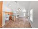Open floor plan with a kitchen, dining area, and a fireplace, creating a cohesive living space at 16036 N 11Th Ave # 1084, Phoenix, AZ 85023