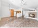 Open concept living space featuring tile flooring, a fireplace, and a ceiling fan for added comfort at 16036 N 11Th Ave # 1084, Phoenix, AZ 85023