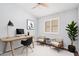 Home office with desk, chair, and window providing natural light at 1712 E Saratoga St, Gilbert, AZ 85296