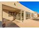 Backyard view showing the covered patio and sunroom with blue skies at 1779 E Kaibab Dr, Chandler, AZ 85249