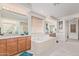 A luxurious bathroom featuring a soaking tub, dual vanities, and granite countertops at 1779 E Kaibab Dr, Chandler, AZ 85249