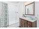 Bathroom with vanity, granite countertops, decorative bowl and stand-up shower with curtains at 1779 E Kaibab Dr, Chandler, AZ 85249