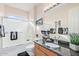 Bathroom with a tub and shower, single sink vanity with dark granite top and decor at 1779 E Kaibab Dr, Chandler, AZ 85249