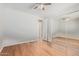 Bright bedroom boasts hardwood floors, a mirrored closet, and a ceiling fan at 1779 E Kaibab Dr, Chandler, AZ 85249