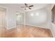 Bedroom with a ceiling fan, closet with mirrors, and hardwood floors at 1779 E Kaibab Dr, Chandler, AZ 85249