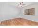 This bedroom features natural light, a ceiling fan, and gorgeous wood floors at 1779 E Kaibab Dr, Chandler, AZ 85249