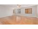 Large bedroom showcasing hardwood floors, a ceiling fan, and multiple windows at 1779 E Kaibab Dr, Chandler, AZ 85249