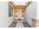 Inviting front entry with neutral colors, covered entrance, and stone accents at 1779 E Kaibab Dr, Chandler, AZ 85249