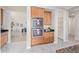 A bright kitchen features stainless steel double ovens and light wood cabinets at 1779 E Kaibab Dr, Chandler, AZ 85249