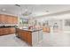 Spacious open-concept kitchen with an island, modern appliances, and adjacent living areas at 1779 E Kaibab Dr, Chandler, AZ 85249