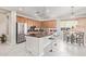 A fully equipped kitchen features an island with stools, stainless steel appliances, and granite countertops at 1779 E Kaibab Dr, Chandler, AZ 85249