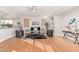 Bright living room with hardwood floors, a ceiling fan, and modern furniture at 1779 E Kaibab Dr, Chandler, AZ 85249