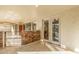Enclosed patio with stone wall, tiled floor, and access to the exterior and sunroom at 1779 E Kaibab Dr, Chandler, AZ 85249