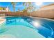 Sparkling pool surrounded by palm trees, providing a refreshing oasis in the backyard at 1779 E Kaibab Dr, Chandler, AZ 85249