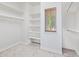 A walk-in closet features shelves and hanging rods for organization at 1779 E Kaibab Dr, Chandler, AZ 85249