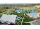 Breathtaking aerial view of the community's pond, pool, park, and event building with lush greenery throughout the neighborhood at 4615 E Calistoga Dr, Gilbert, AZ 85297