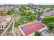 Community aerial view featuring a basketball court, volleyball area, green spaces, and residential homes at 4615 E Calistoga Dr, Gilbert, AZ 85297