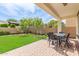 Covered back patio with brick flooring, perfect for outdoor dining and entertaining at 4615 E Calistoga Dr, Gilbert, AZ 85297