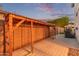 Backyard utility area featuring a wooden structure for storage, on a concrete surface at 4615 E Calistoga Dr, Gilbert, AZ 85297