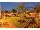 Beautiful backyard featuring a playhouse, hot tub, fresh lawn, and lush landscaping at 4615 E Calistoga Dr, Gilbert, AZ 85297