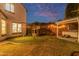 Spacious backyard boasts a playset, hot tub under pergola, and lush lawn at 4615 E Calistoga Dr, Gilbert, AZ 85297